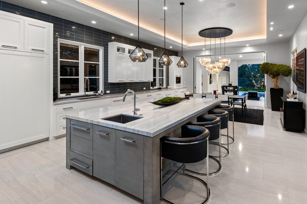 The Home in Newport Beach is a beautifully constructed estate showcases an open floor plan with stunning views of the rolling hills now available for sale. This home located at 42 Offshore, Newport Beach, California