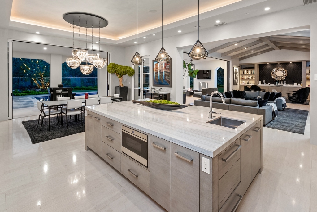 The Home in Newport Beach is a beautifully constructed estate showcases an open floor plan with stunning views of the rolling hills now available for sale. This home located at 42 Offshore, Newport Beach, California