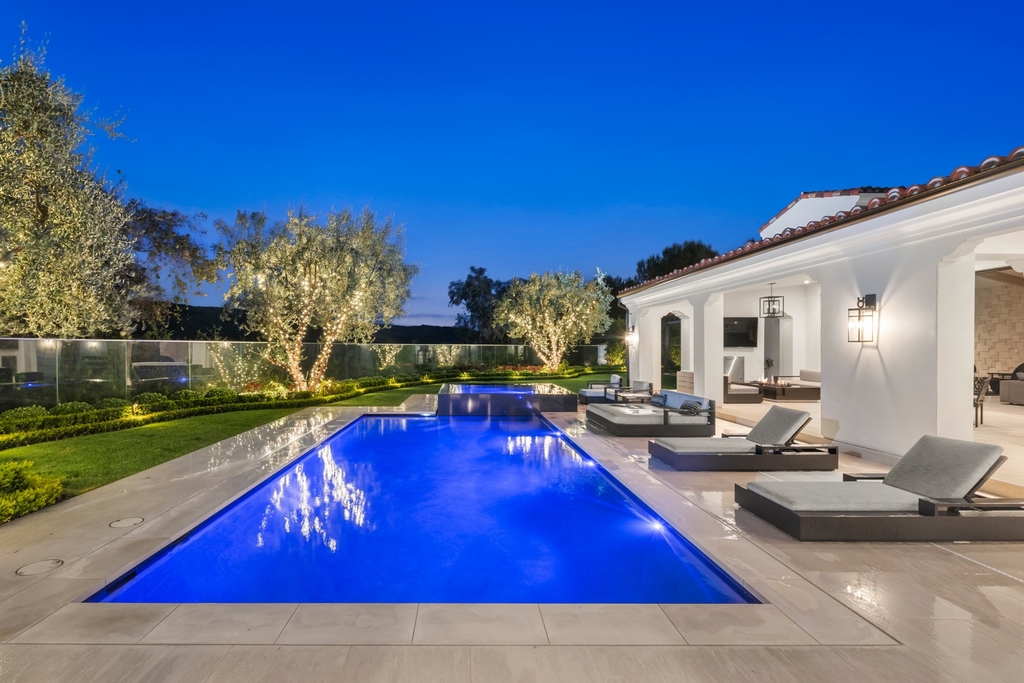 The Home in Newport Beach is a beautifully constructed estate showcases an open floor plan with stunning views of the rolling hills now available for sale. This home located at 42 Offshore, Newport Beach, California