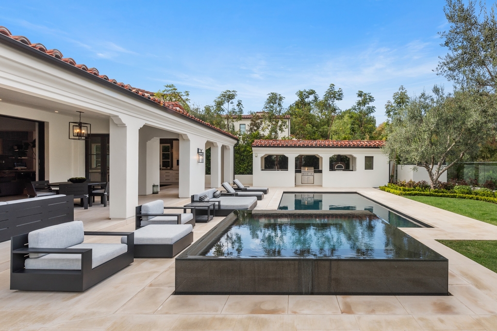 The Home in Newport Beach is a beautifully constructed estate showcases an open floor plan with stunning views of the rolling hills now available for sale. This home located at 42 Offshore, Newport Beach, California