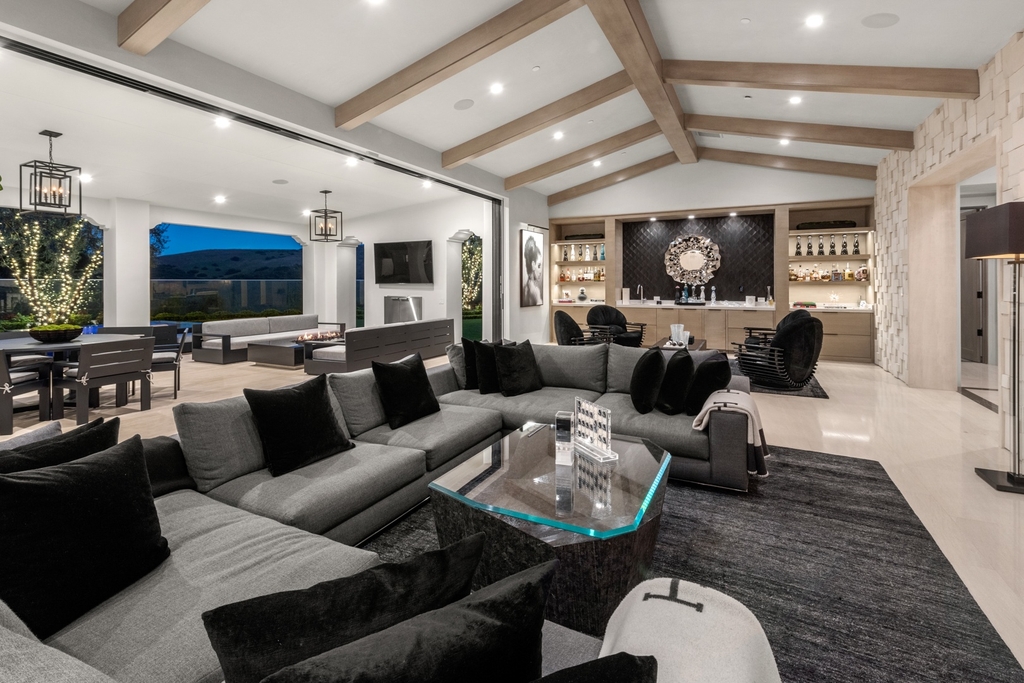 The Home in Newport Beach is a beautifully constructed estate showcases an open floor plan with stunning views of the rolling hills now available for sale. This home located at 42 Offshore, Newport Beach, California