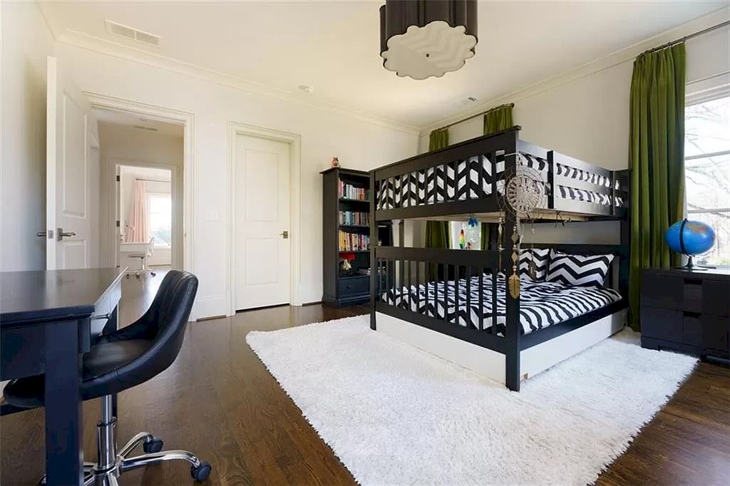 You can't go wrong with wood tones and a fur rug for a rustic appearance. This room's bright walls provide the ideal counterpoint to the dark bunk bed frame.