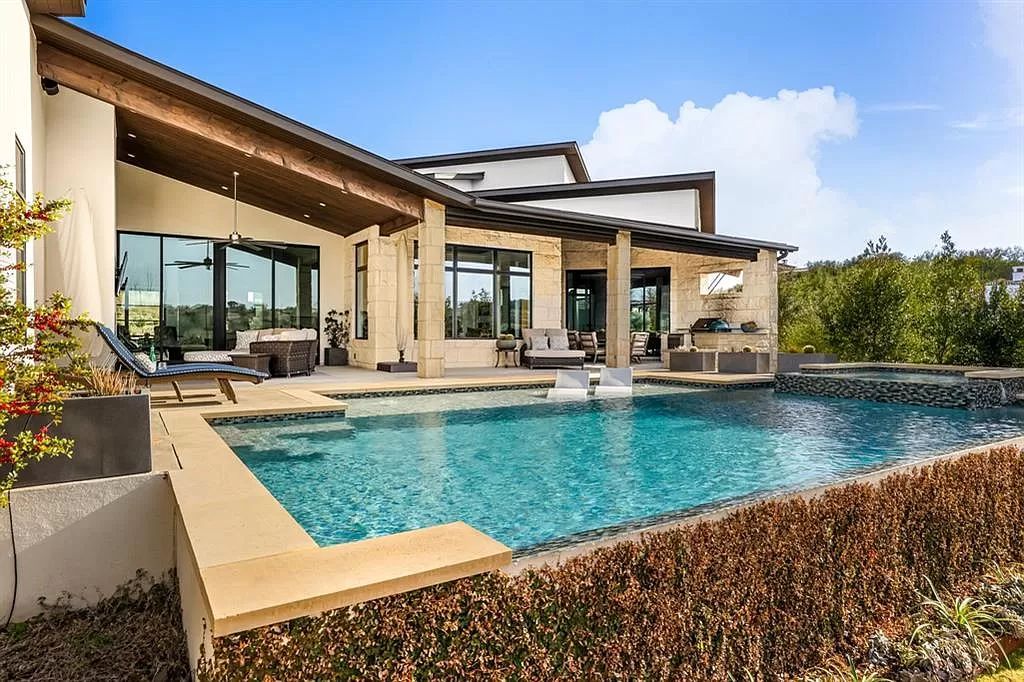 The Home in Austin is a Spanish Oaks contemporary home with sweeping views from virtually every window along the backside now available for sale. This home located at 11724 Musket Rim St, Austin, Texas