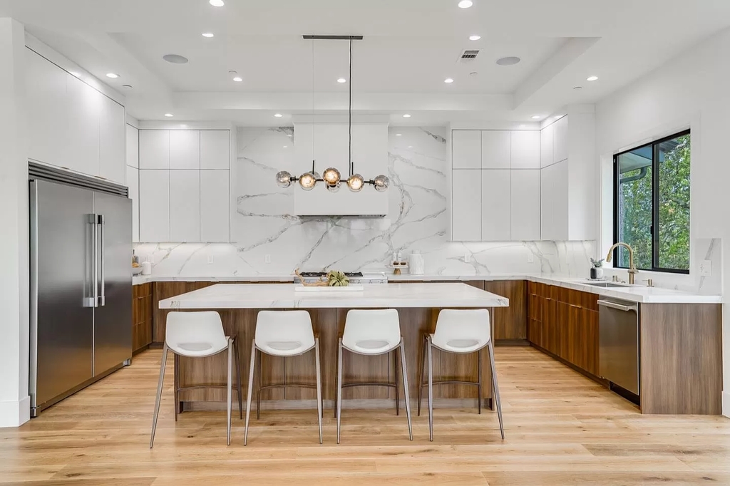 The Home in San Jose is a luxurious modern property has an emphasis on sleekness now available for sale. This home located at 7165 Red Holly Ct, San Jose, California