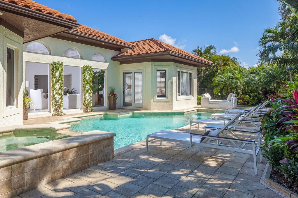 The Home in Naples is a custom residence with glorious southern exposure, soaring ceilings and floor to ceiling windows now available for sale. This home located at 750 Fountainhead Ln, Naples, Florida