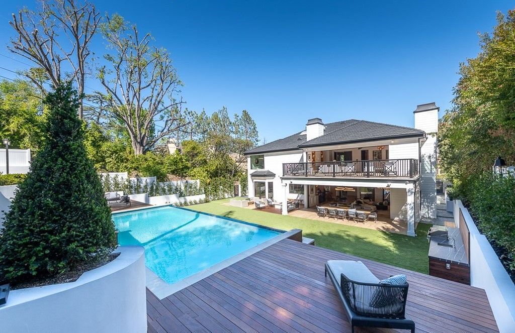 The Farmhouse in Encino is a unparalleled luxury and exquisite design with resort-styled rear oasis features a heated pavilion, perfect for outdoor dining now available for sale. This home located at 4651 Louise Ave, Encino, California