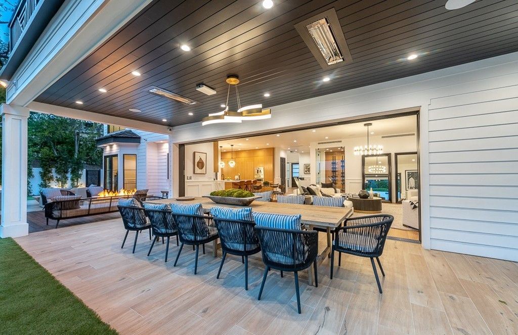 The Farmhouse in Encino is a unparalleled luxury and exquisite design with resort-styled rear oasis features a heated pavilion, perfect for outdoor dining now available for sale. This home located at 4651 Louise Ave, Encino, California