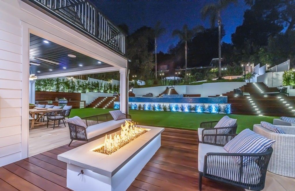 The Farmhouse in Encino is a unparalleled luxury and exquisite design with resort-styled rear oasis features a heated pavilion, perfect for outdoor dining now available for sale. This home located at 4651 Louise Ave, Encino, California