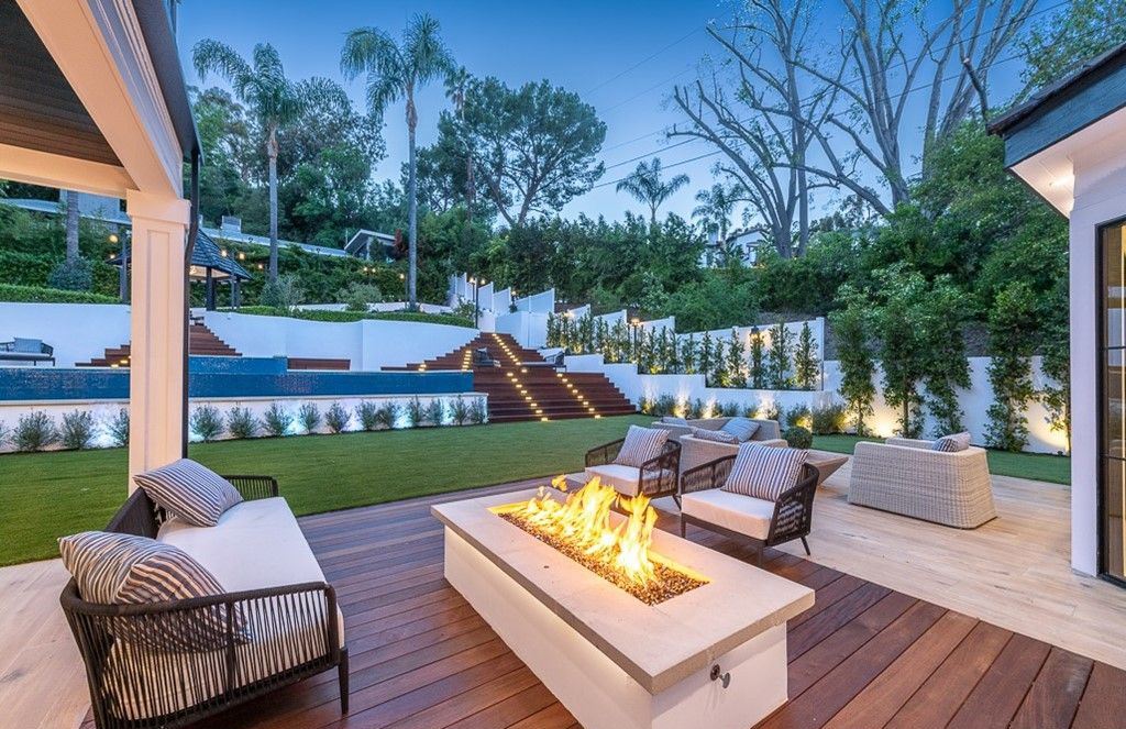 The Farmhouse in Encino is a unparalleled luxury and exquisite design with resort-styled rear oasis features a heated pavilion, perfect for outdoor dining now available for sale. This home located at 4651 Louise Ave, Encino, California