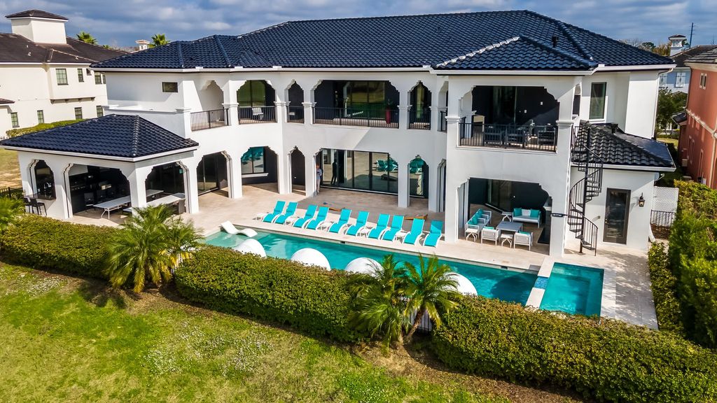 The Home in Reunion is a stunning fully furnished residence has an open contemporary floor plan which exudes luxury now available for sale. This home located at 521 Muirfield Loop, Reunion, Florida