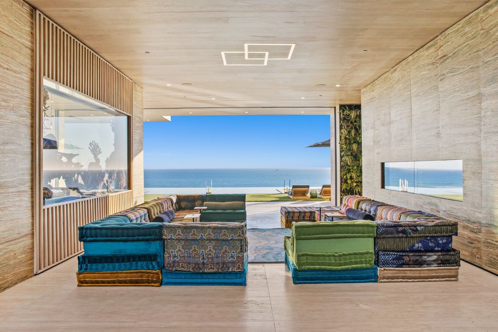 The Malibu Mansion is a newly constructed home features over 20,000 square feet of artisan crafted perfection set on 1 acre of lush tropical landscape now available for sale. This home located at 11870 Ellice St, Malibu, California