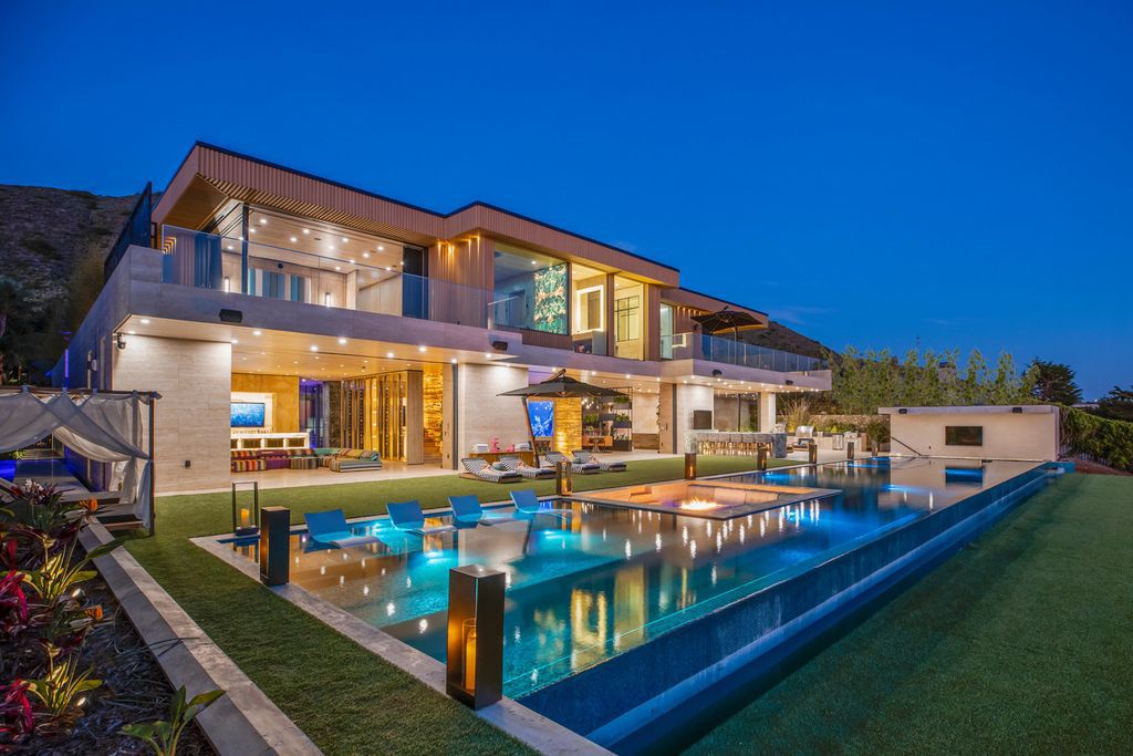 The Malibu Mansion is a newly constructed home features over 20,000 square feet of artisan crafted perfection set on 1 acre of lush tropical landscape now available for sale. This home located at 11870 Ellice St, Malibu, California