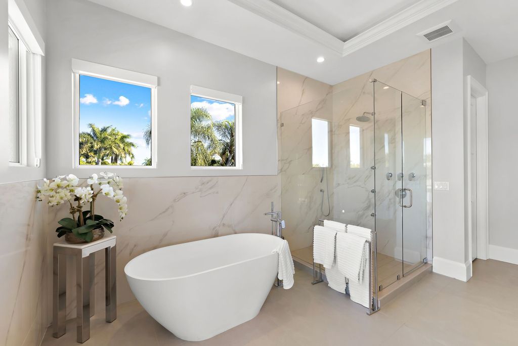 The Home in Naples is a sleek estate with a spacious interior and exquisite finishes on every surface now available for sale. This home located at 1275 Wahoo Ct, Naples, Florida