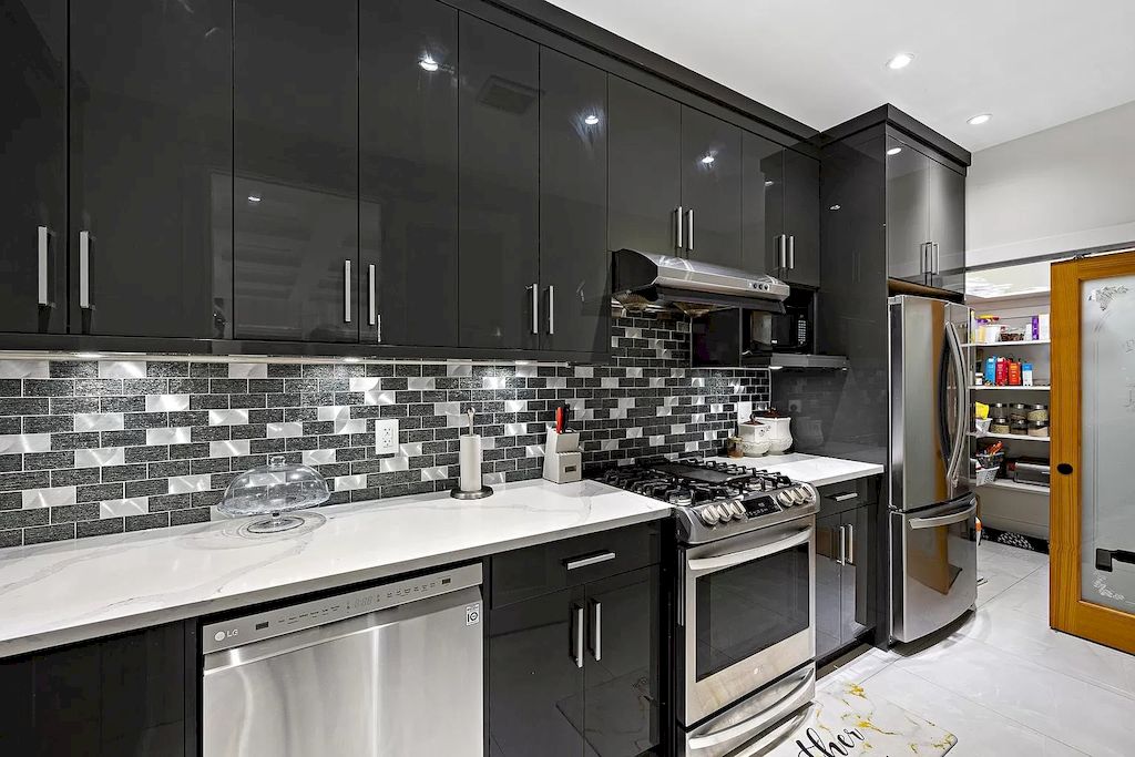 For a kitchen that exudes sophistication and drama, consider dark charcoal grey cabinets. This bold choice adds depth and creates a striking focal point. Pair the cabinets with contrasting elements, such as white marble countertops and a herringbone patterned backsplash in shades of white or light gray. Incorporate statement lighting fixtures, like oversized pendant lights or a chandelier, to add a touch of glamour. Balance the dark cabinets with light-colored flooring and accents to create a visually balanced and transitional space.