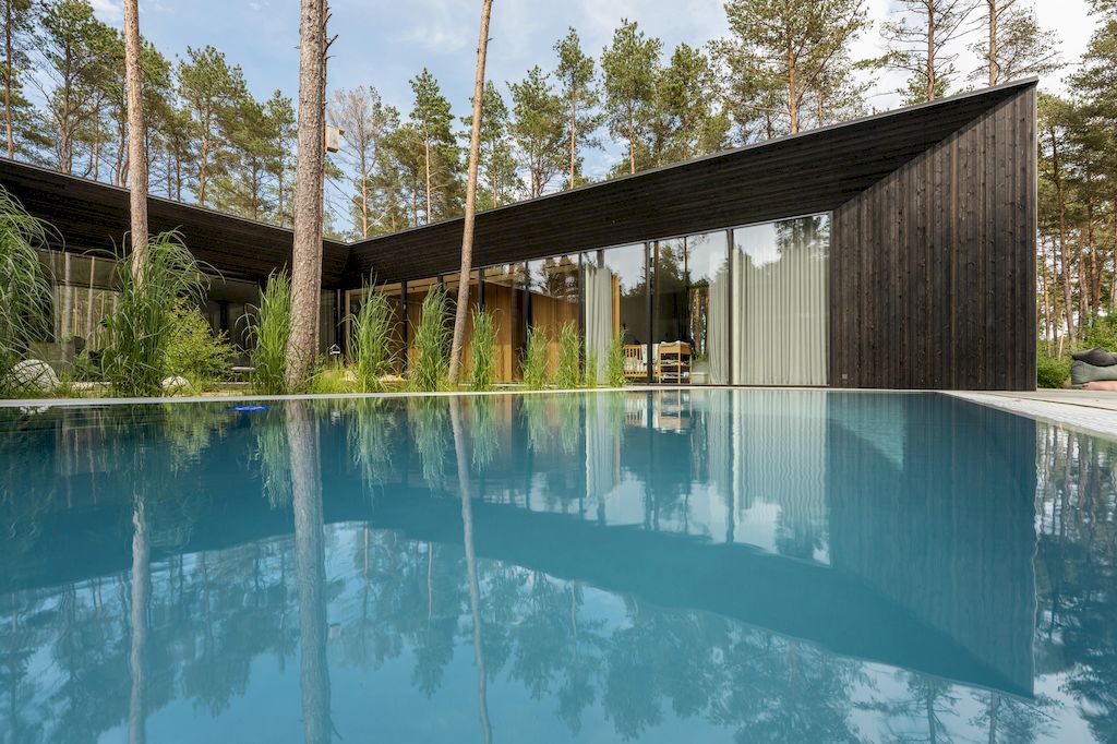 U shaped House Estonian wraps around a private garden by Kuu Arhitektid