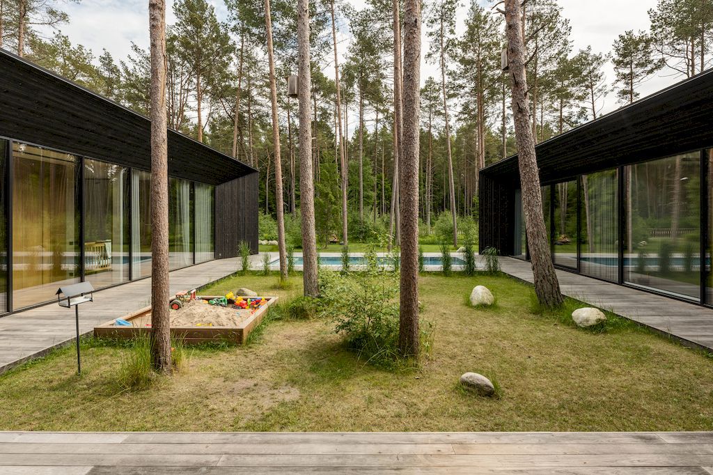 U shaped House Estonian wraps around a private garden by Kuu Arhitektid