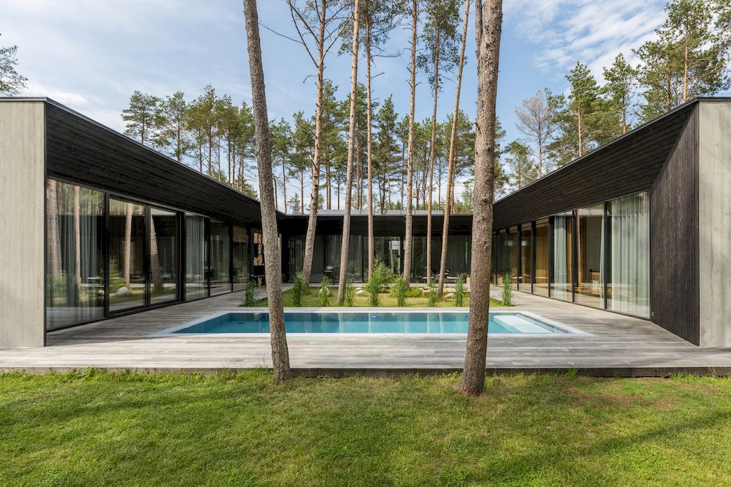 U shaped House Estonian wraps around a private garden by Kuu Arhitektid