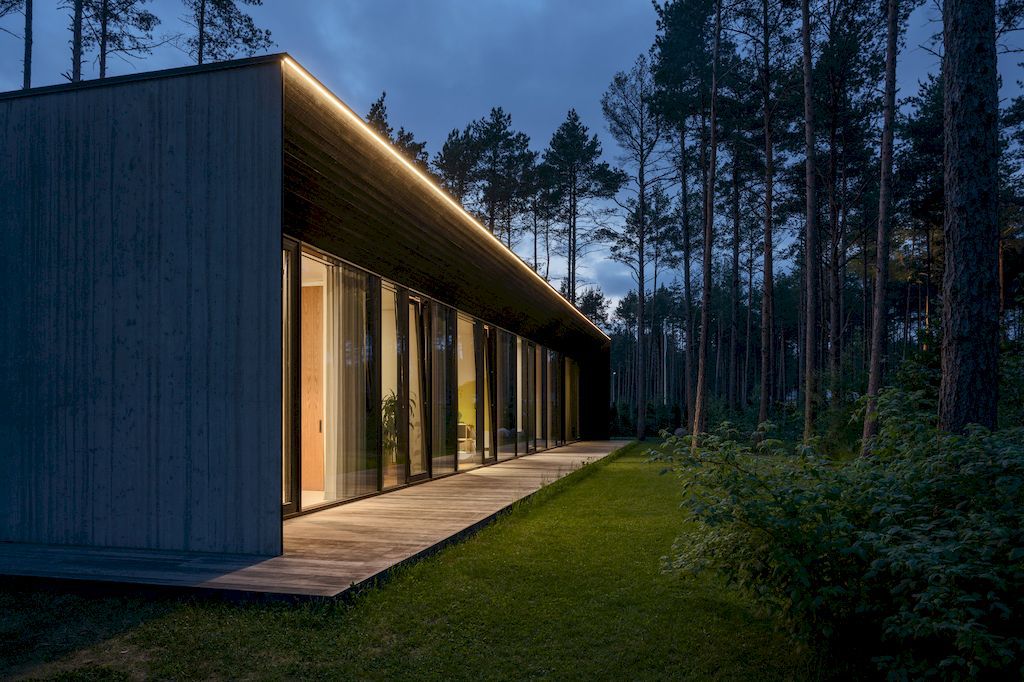 U shaped House Estonian wraps around a private garden by Kuu Arhitektid