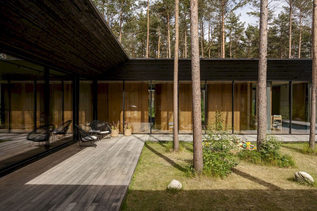 U shaped House Estonian wraps around a private garden by Kuu Arhitektid