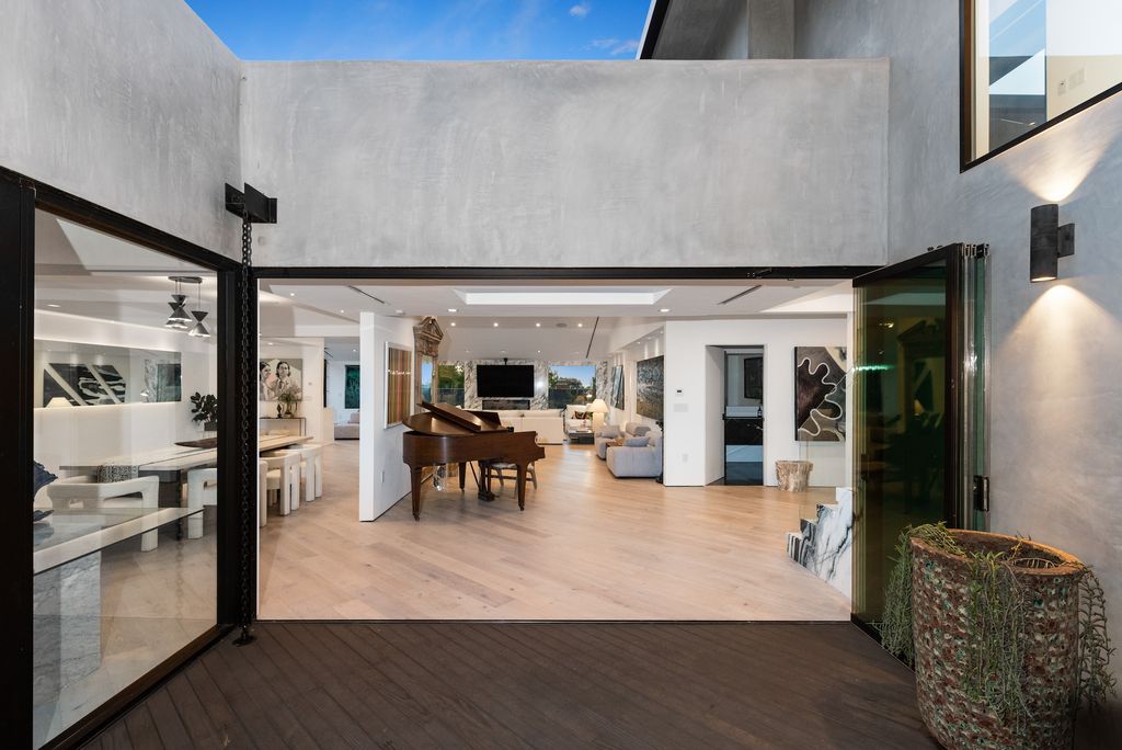 The Home in Los Angeles is a mid century gem just totally reimagined with poise and style and evoking midcentury design now available for sale. This home located at 1558 Rising Glen Rd, Los Angeles, California