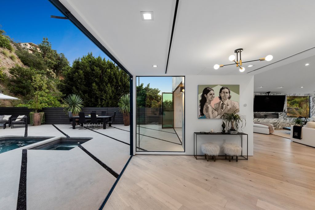 The Home in Los Angeles is a mid century gem just totally reimagined with poise and style and evoking midcentury design now available for sale. This home located at 1558 Rising Glen Rd, Los Angeles, California