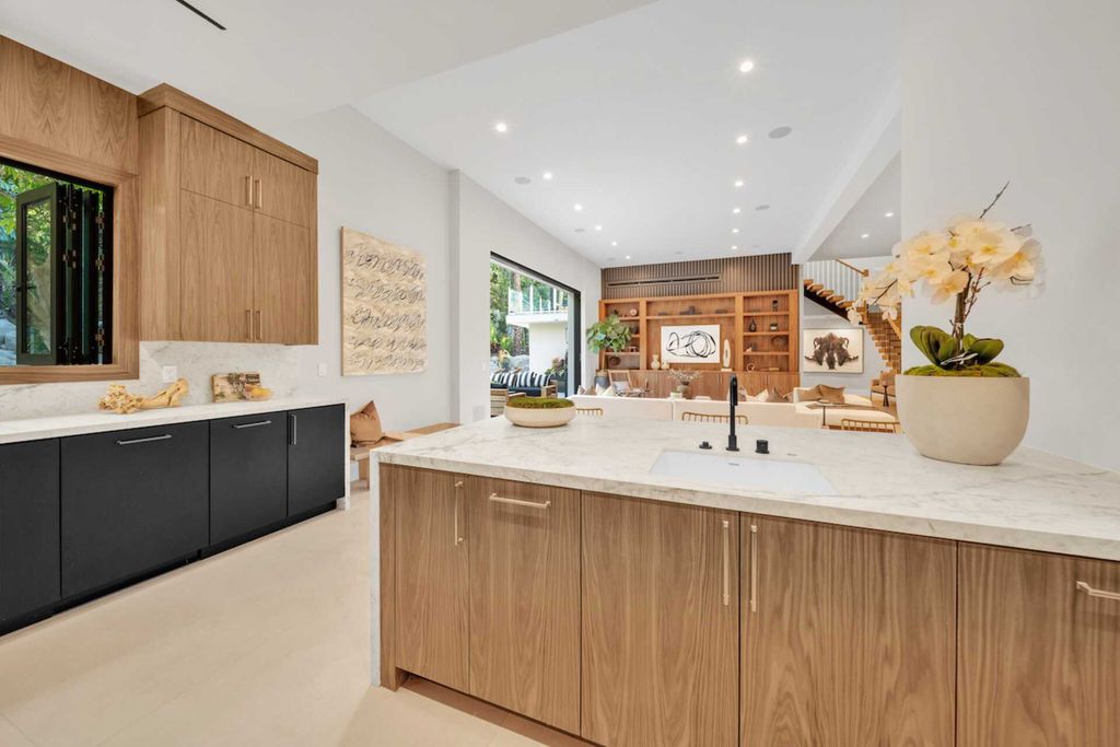 The Home in Encino is a privately gated contemporary offers sophistication, luxury, and relaxation boasting a pristine residence now available for sale. This home located at 4609 Louise Ave, Encino, California
