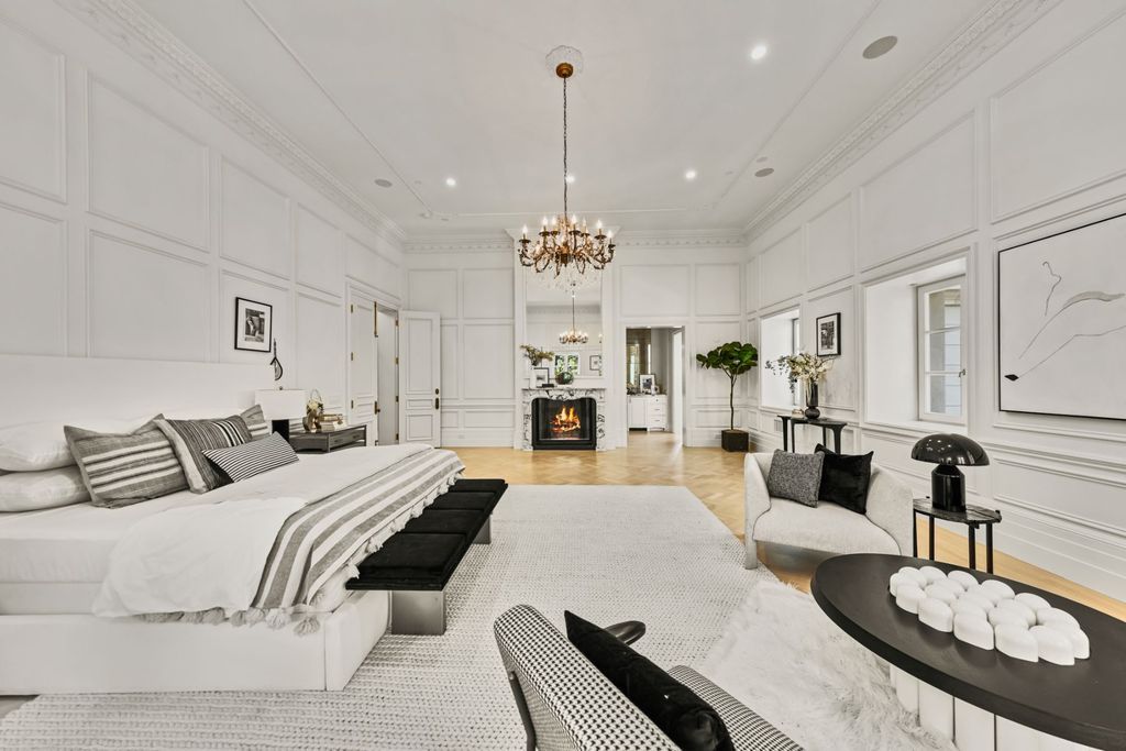 The above Black And White Bedroom is built by the synthesis of many ways of combining white and black colors. The white ceiling, paint, and rug create maximum contrast and provide the background for accent pieces such as table lamps, a bedroom bench, and throw pillows. The small polka dot pattern of the chair set used for seating areas is also a highlight to help your bedroom look more trendy.