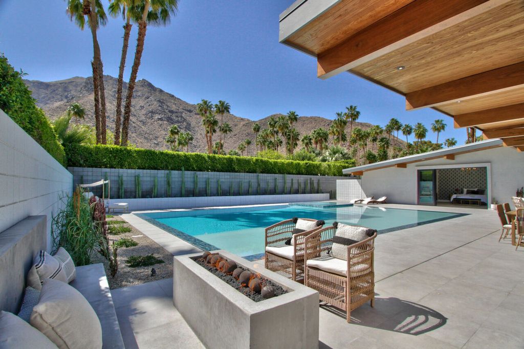 The Home in Palm Springs is a flawless mid century pool estate with the highest level of finish and sophistication surrounded by pristine mountain views now available for sale. This home located at 1189 N Rose Ave, Palm Springs, California