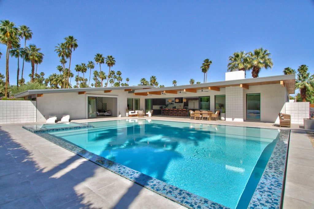 The Home in Palm Springs is a flawless mid century pool estate with the highest level of finish and sophistication surrounded by pristine mountain views now available for sale. This home located at 1189 N Rose Ave, Palm Springs, California