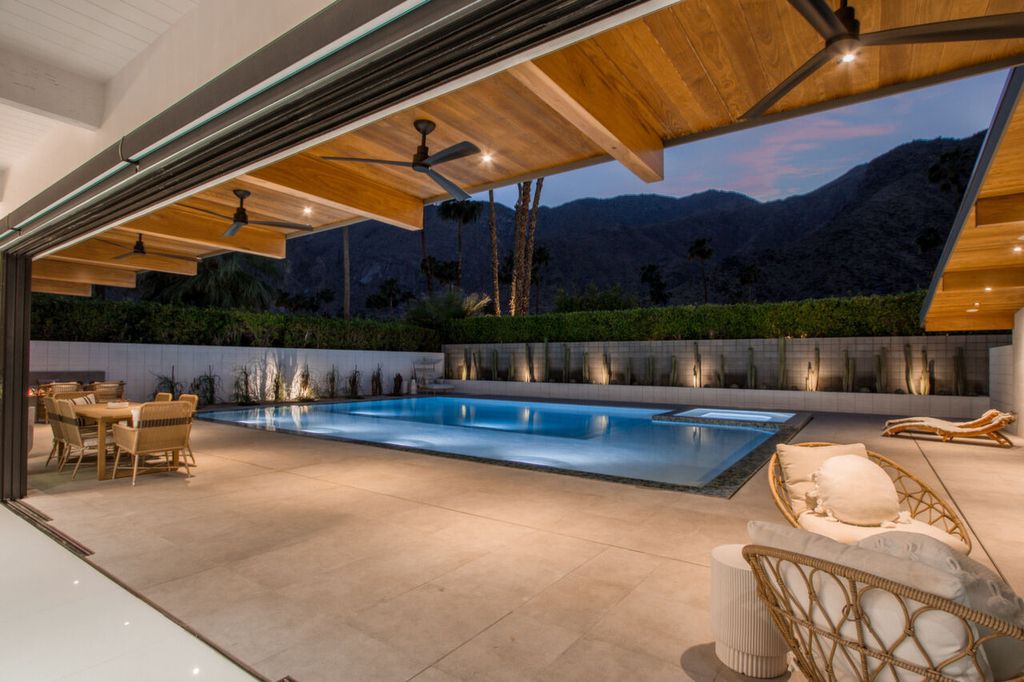 The Home in Palm Springs is a flawless mid century pool estate with the highest level of finish and sophistication surrounded by pristine mountain views now available for sale. This home located at 1189 N Rose Ave, Palm Springs, California