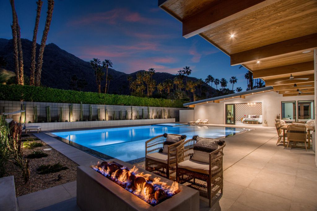 The Home in Palm Springs is a flawless mid century pool estate with the highest level of finish and sophistication surrounded by pristine mountain views now available for sale. This home located at 1189 N Rose Ave, Palm Springs, California