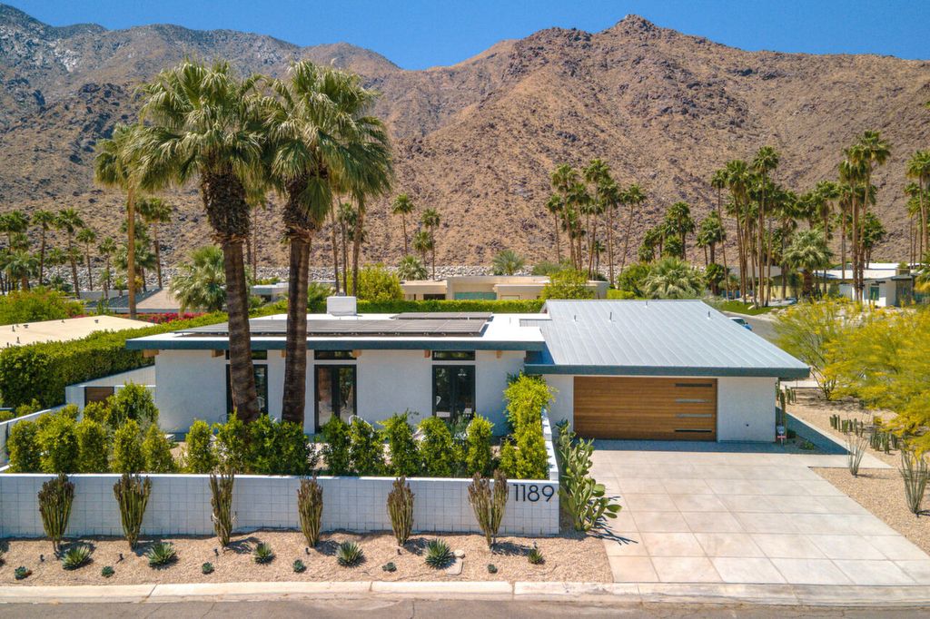 The Home in Palm Springs is a flawless mid century pool estate with the highest level of finish and sophistication surrounded by pristine mountain views now available for sale. This home located at 1189 N Rose Ave, Palm Springs, California