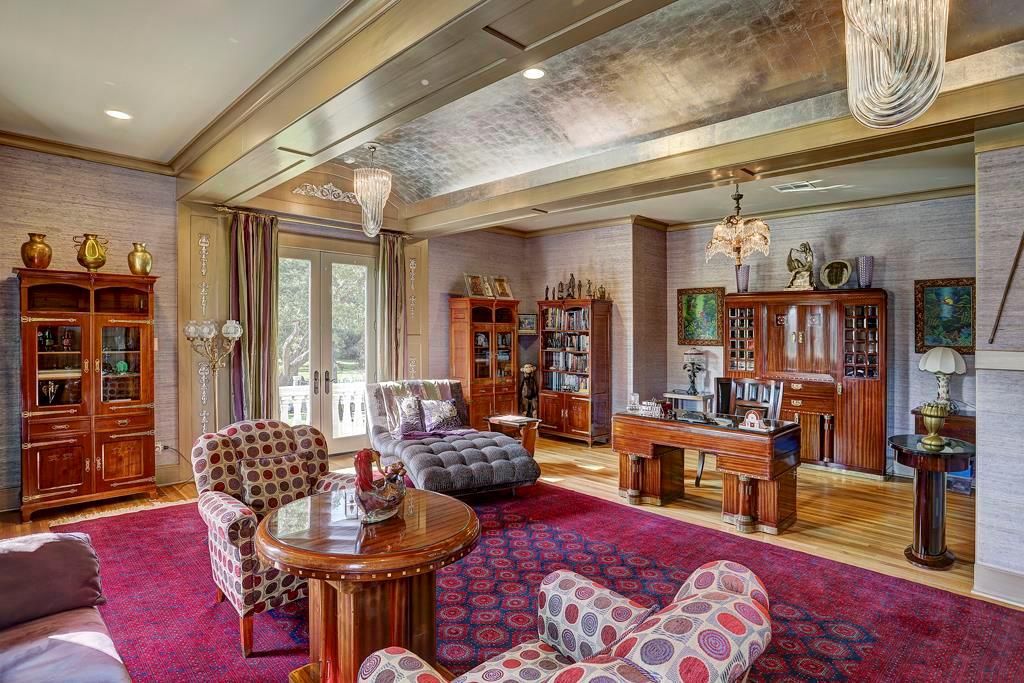 You can apply multiple shapes of red to the details of your living room at the same time, but it takes a bit of arrangement to make your palette feel cohesive. This living room idea starts from a large bold red rug to other smaller red details like the pattern on the pair of cough. It unites and brings together as one. 