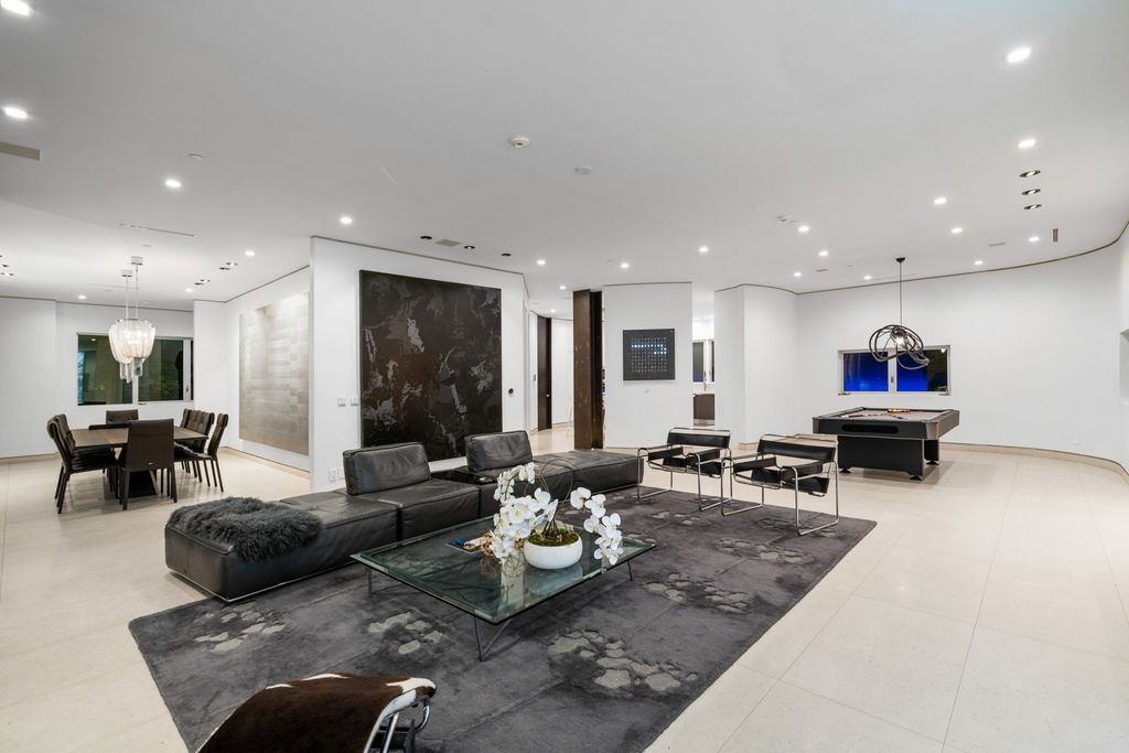 The Home in Bel Air is a modern architectural masterpiece nestled behind gates in a lush canyon setting with meticulously crafted living space now available for sale. This home located at 1006 Chantilly Rd, Los Angeles, California