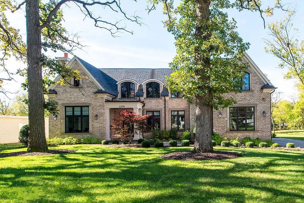 The Home in Illinois is a luxurious home possessing warm brick facade, elegant rooms and flawless finishes now available for sale. This home located at 1270 Church St, Northbrook, Illinois; offering 06 bedrooms and 07 bathrooms with 8,500 square feet of living spaces.