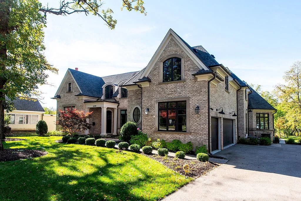The Home in Illinois is a luxurious home possessing warm brick facade, elegant rooms and flawless finishes now available for sale. This home located at 1270 Church St, Northbrook, Illinois; offering 06 bedrooms and 07 bathrooms with 8,500 square feet of living spaces.