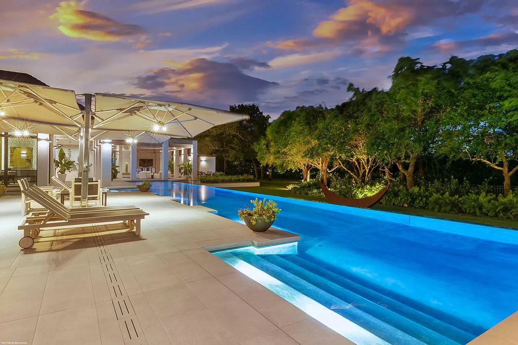 The Mansion in Jupiter is a magnificent home constructed from the finest materials and inspired from amazing resorts around the world now available for sale. This home located at 126 Bears Club Dr, Jupiter, Florida