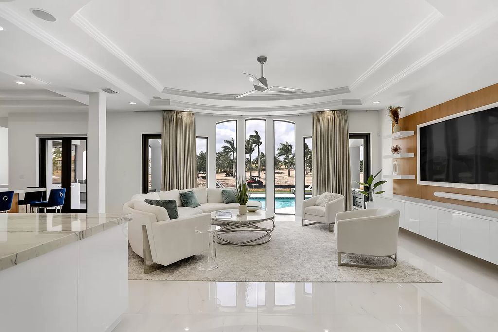 The Home in Boca Raton is a Two story Transitional Contemporary with exceptional water and expansive golf course vistas of the Fazio west golf course now available for sale. This home located at 7645 Fenwick Pl, Boca Raton, Florida