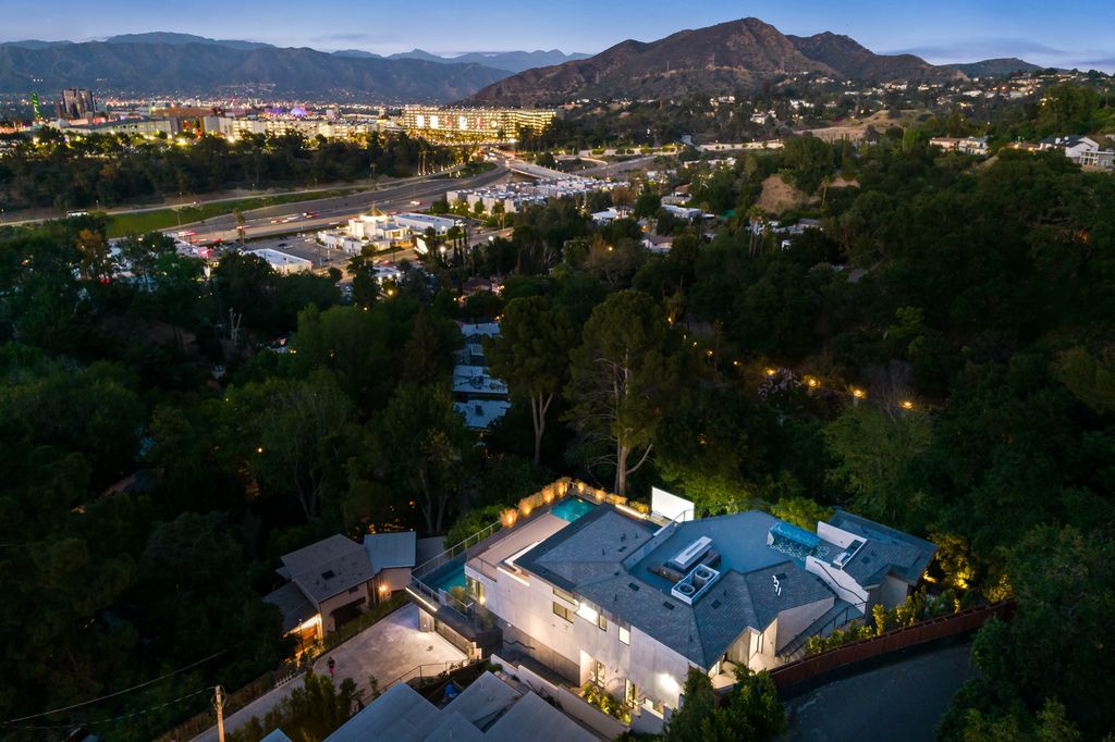 The Home in Los Angeles is an architectural jewel designed by Alon Zakoot overlooking the mountain vistas and spectacular city views now available for sale. This home located at 3712 Broadlawn Dr, Los Angeles, California