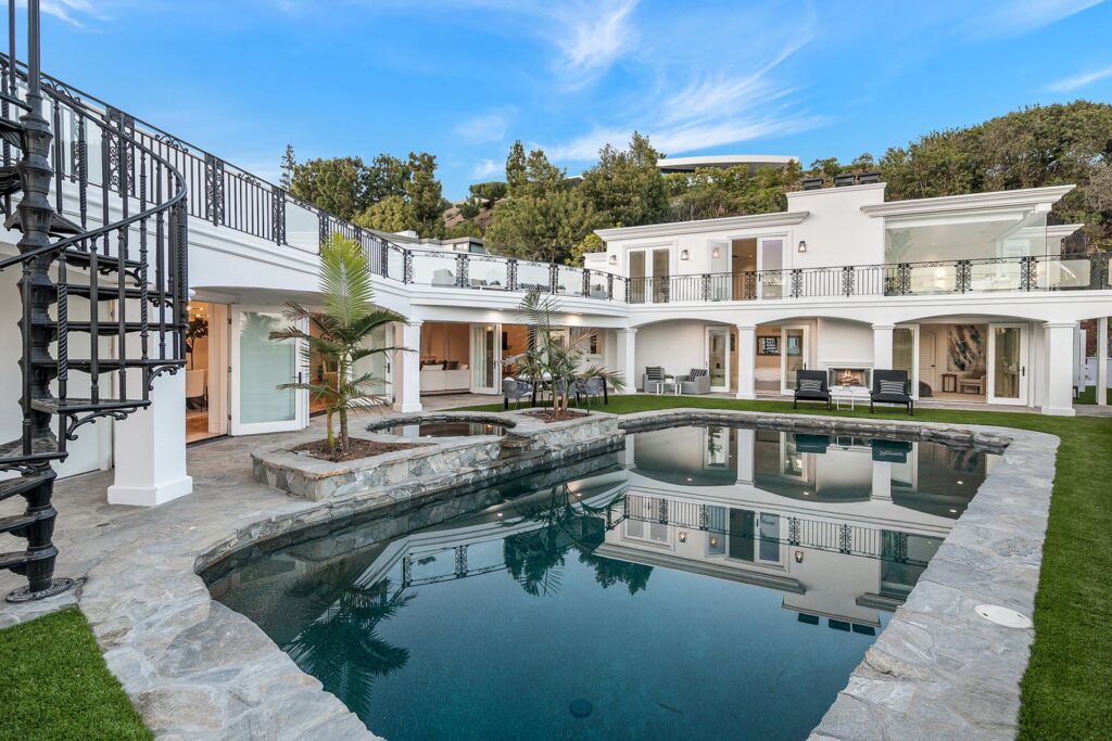 The Home in Beverly Hills is one of the few residences in Trousdale Estates with an above ground second story encompassing explosive city and ocean views. now available for sale. This home located at 25 Arkell Dr, Beverly Hills, California