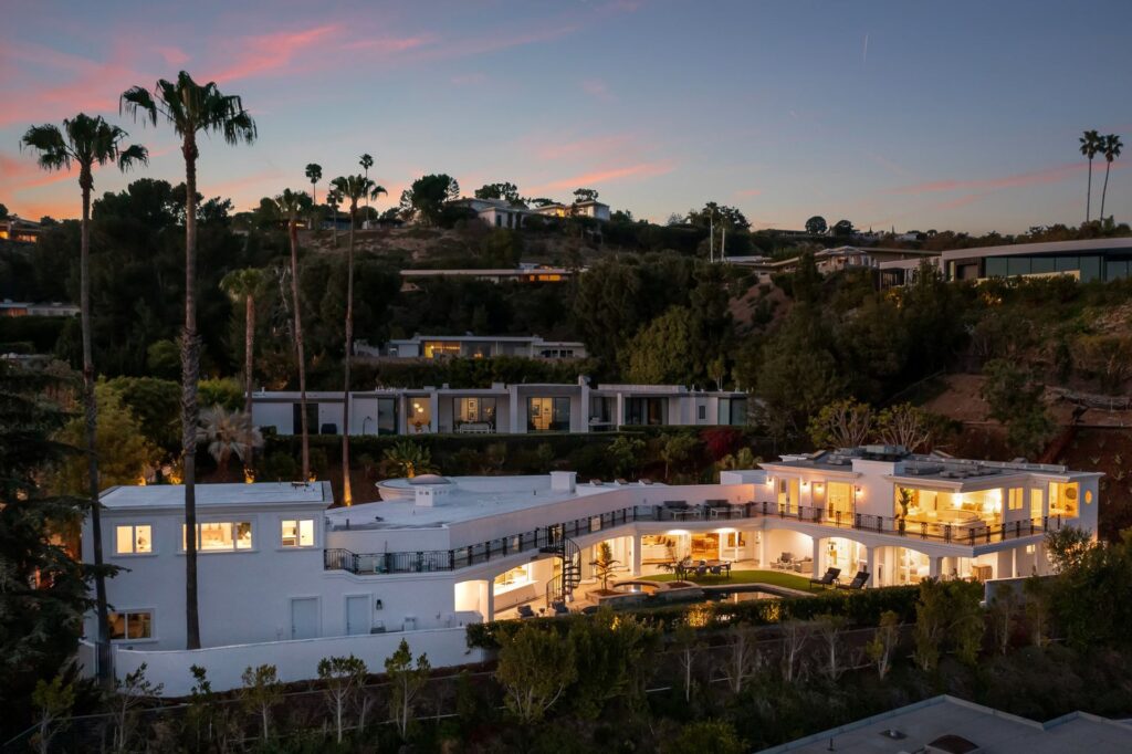 The Home in Beverly Hills is one of the few residences in Trousdale Estates with an above ground second story encompassing explosive city and ocean views. now available for sale. This home located at 25 Arkell Dr, Beverly Hills, California