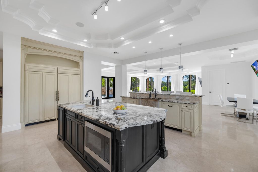 The Parkland Estate is a Country Club home with Glamour has been updated with a state-of-the-art surround system and smart features now available for sale. This home located at 7427 Stonegate Blvd, Parkland, Florida