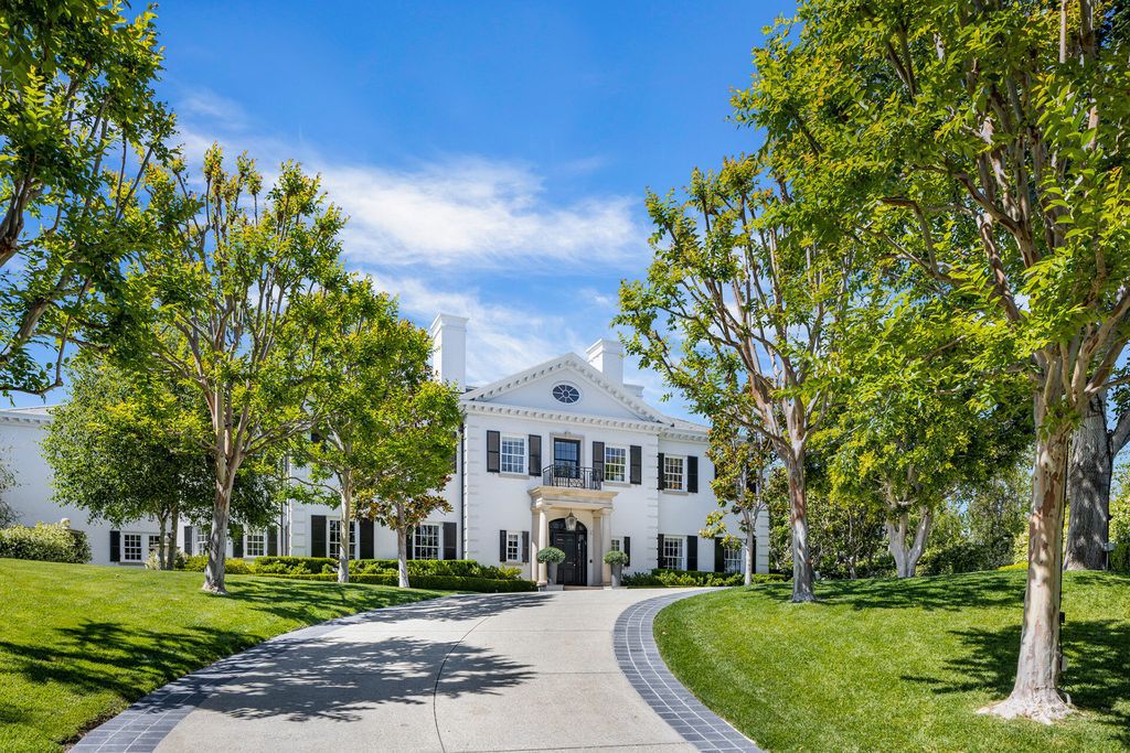 The Mansion in Bel Air is a stunning traditional estate recently remodeled with a sweeping staircase, a large living room and a very large swimming pool now available for sale. This home located at 385 Copa De Oro Rd, Los Angeles, California