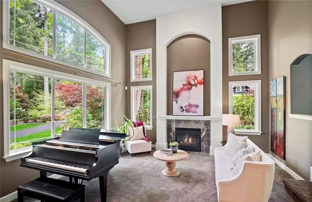 The Estate in Redmond welcomes you with a grand entry spiral staircase, lead glass French doors & vaulted ceilings, now available for sale. This home located at 21505 NE 87th Place, Redmond, Washington