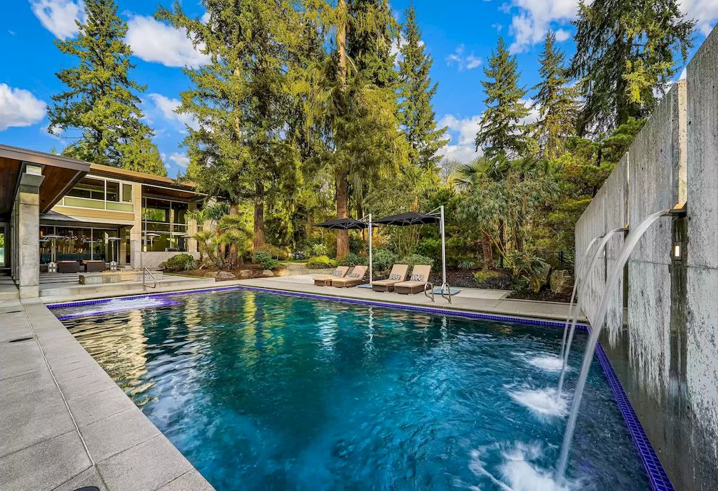The Estate in Washington is a luxurious home with glass walls to bring nature inside now available for sale. This home located at 7917 219th Avenue NE, Redmond, Washington; offering 03 bedrooms and 07 bathrooms with 4,690 square feet of living spaces.
