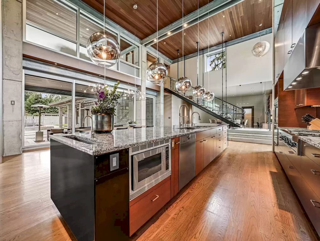 The Estate in Washington is a luxurious home with glass walls to bring nature inside now available for sale. This home located at 7917 219th Avenue NE, Redmond, Washington; offering 03 bedrooms and 07 bathrooms with 4,690 square feet of living spaces.