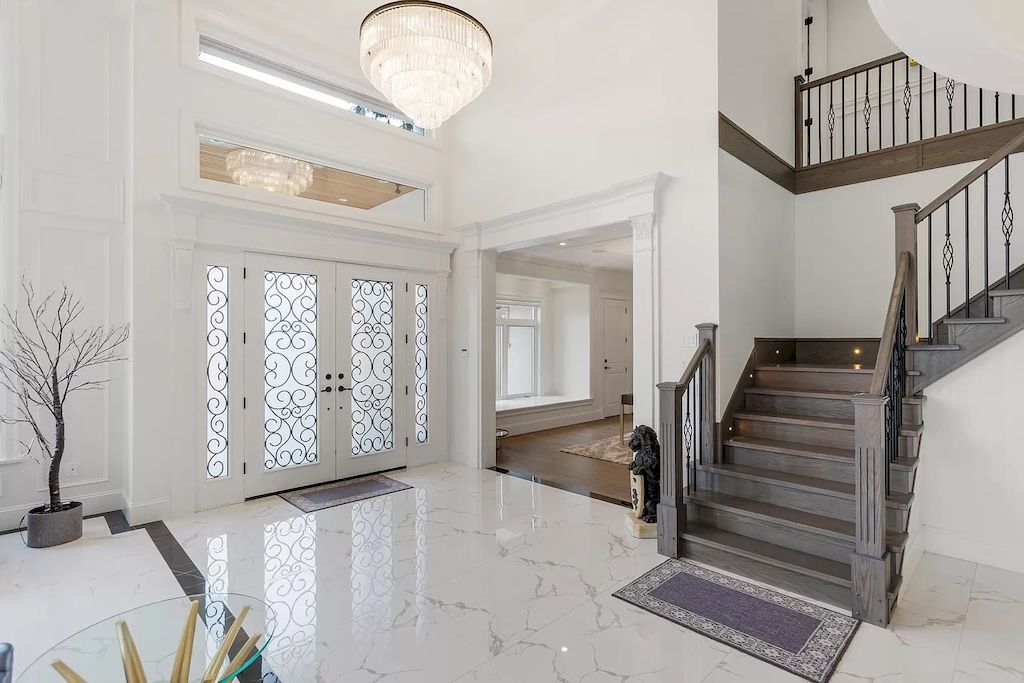 The Home in Richmond offers open layout with grand entrance foyer, elevated ceilings in living room, now available for sale. This home located at 7320 Nevis Dr, Richmond, BC V7A 1J6, Canada