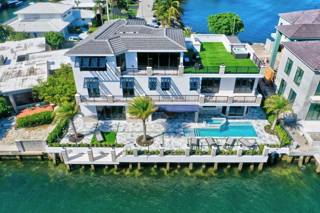 The Home in Boca Raton is a new waterfront home on the edge of the intracoastal with highest level of Furniture and art work now available for sale. This home located at 2900 NE 8th Ave, Boca Raton, Florida