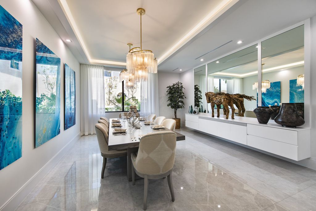 The Home in Boca Raton is a newly renovated Estate in the prestigious Royal Palm Yacht and Country Club with resort-style amenities now available for sale. This home located at 231 Thatch Palm Dr, Boca Raton, Florida