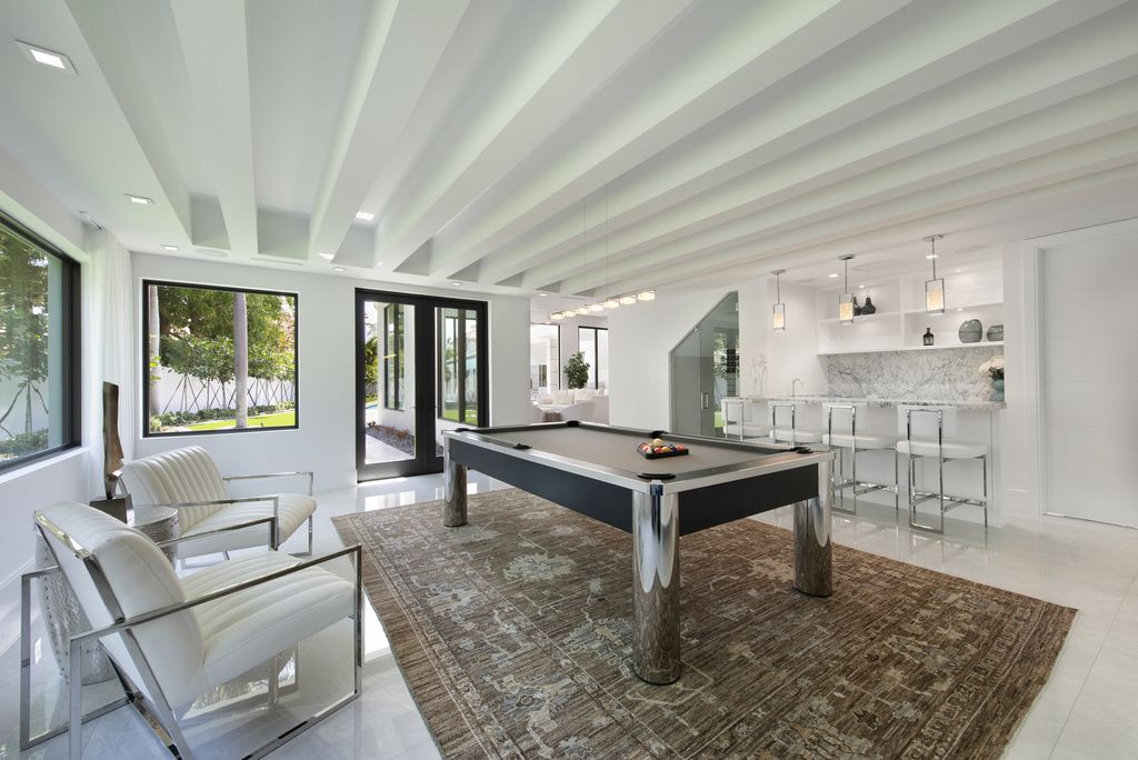 The Home in Boca Raton is a newly renovated Estate in the prestigious Royal Palm Yacht and Country Club with resort-style amenities now available for sale. This home located at 231 Thatch Palm Dr, Boca Raton, Florida